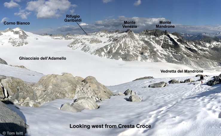 Panoramic view of snowy mountains, glaciers, and labels identifying peaks and ridges.